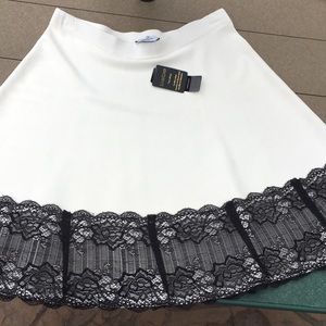 NWT bebe white sweater skirt w/ black lace detail